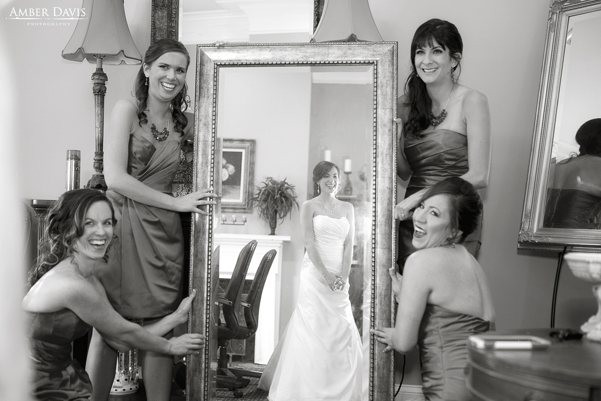 bridesmaids and bride in mirror
